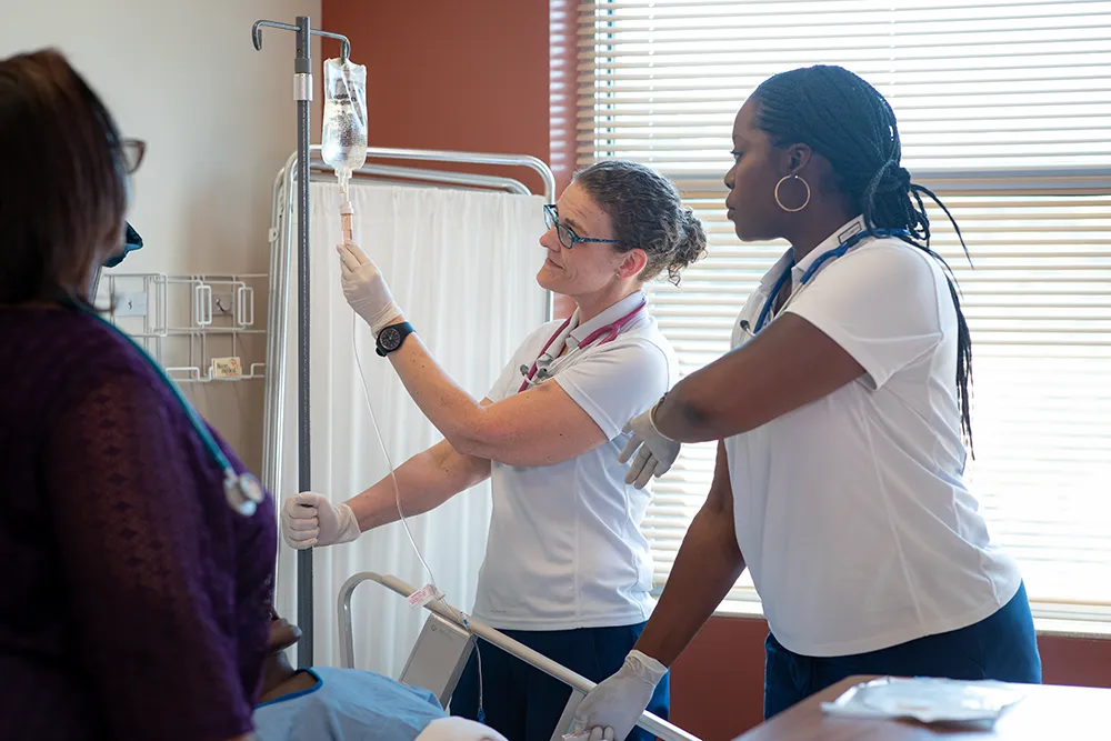 Student inspecting medical equipment in lab